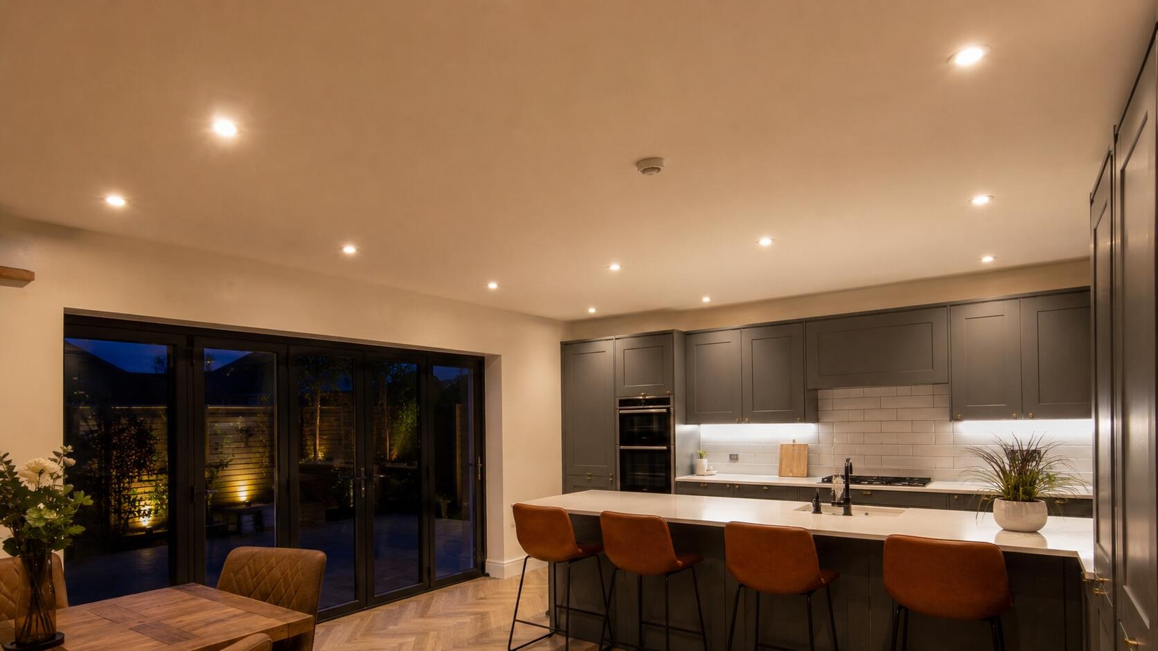 Downlit kitchen at dusk in a Bexley home, lighting and heating installed by Cobra Building Services
