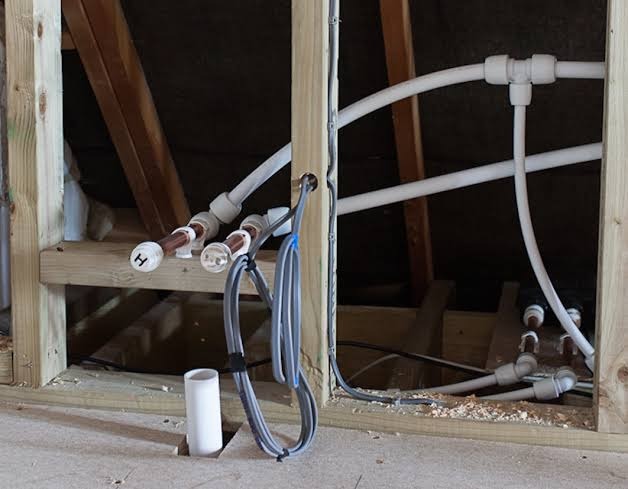 Heating manifold and pipe runs in a loft